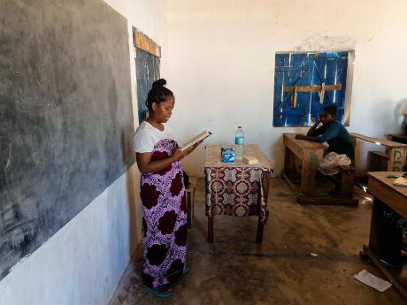 Evangelist's wife teaching at a bush school