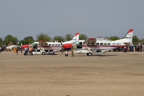 MAF planes waiting for Carter Center Eye team at the airstrip in Yuai 