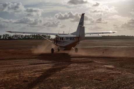 A GippsAero GA8 Airvan taxiing into the sunset