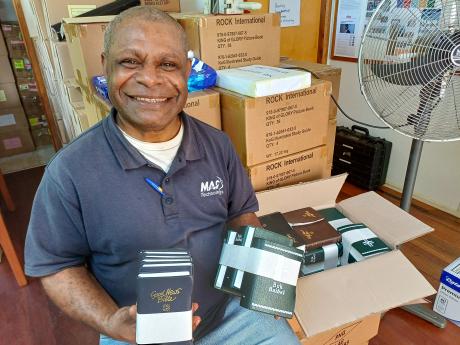 A man with some Bibles