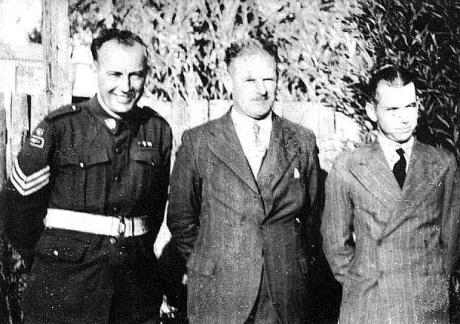 Three men smiling