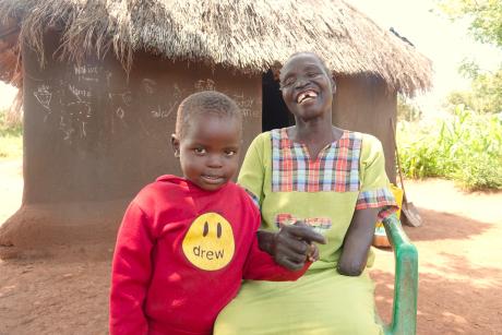 Vicky Eimane with her grand child at Pagirinya refugee settlement 