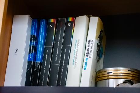 Safety manuals in bookshelf