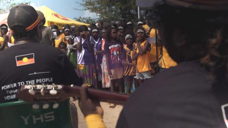 Students singing and dancing