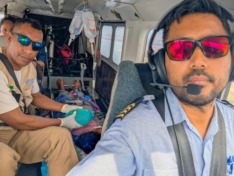 A pilot in the cockpit during a medevac