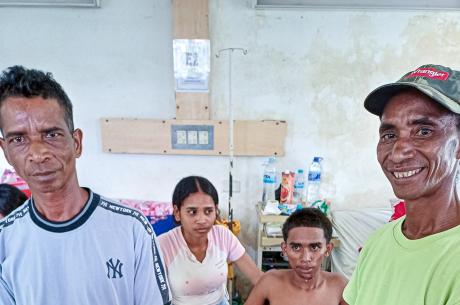 A patient with family members in a hospital in Timor Leste