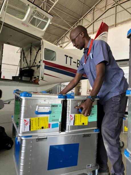 MAF staff loading medical cargo into the plane.