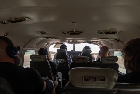 Interior view of passengers in aircraft cabin
