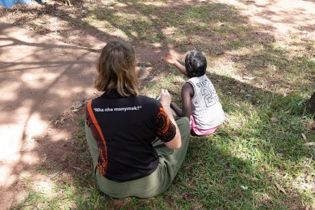 womand girl seated on ground