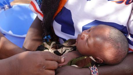Baby Maiko receiving his first vaccinations