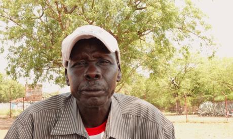 Canon Peter Oduha poses for a photo just outside the Diocese of Torit.