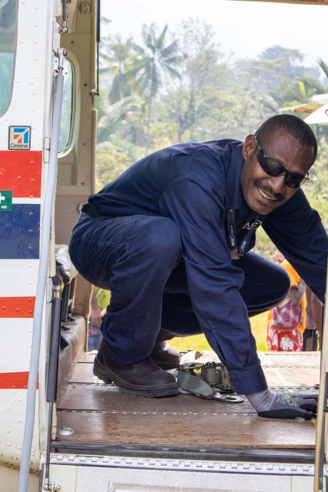 Raynold Nimiha, MAF ground crew at Wewak, helping to unload at Kaiam